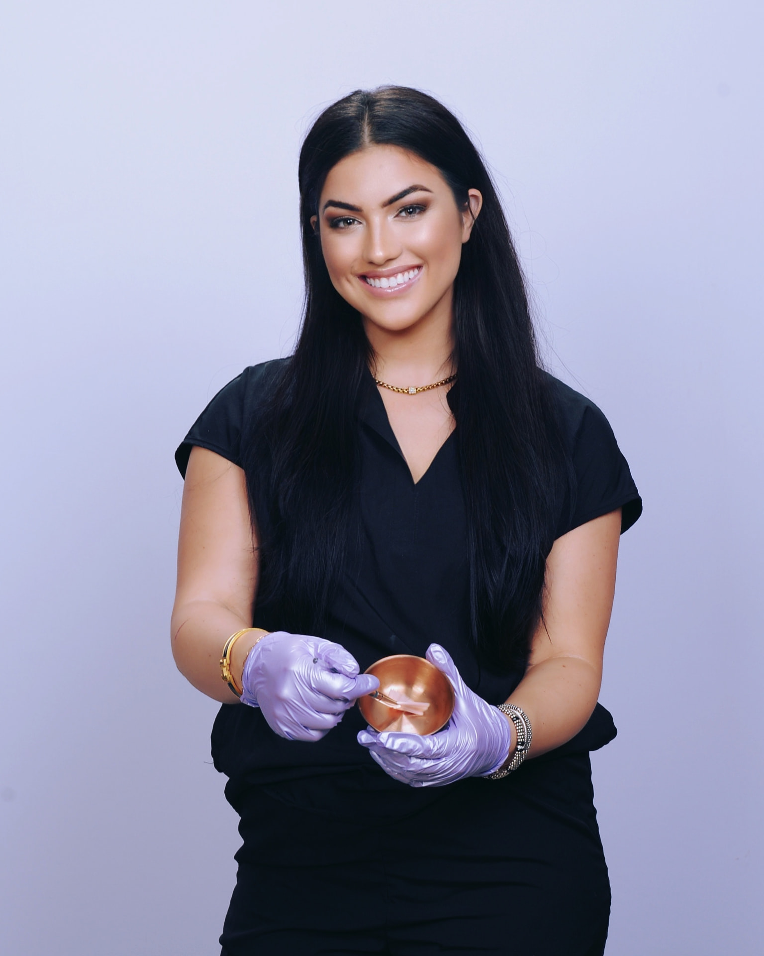 Katelyn, the esthetician behind KK Beauty Lounge, smiling in her studio
